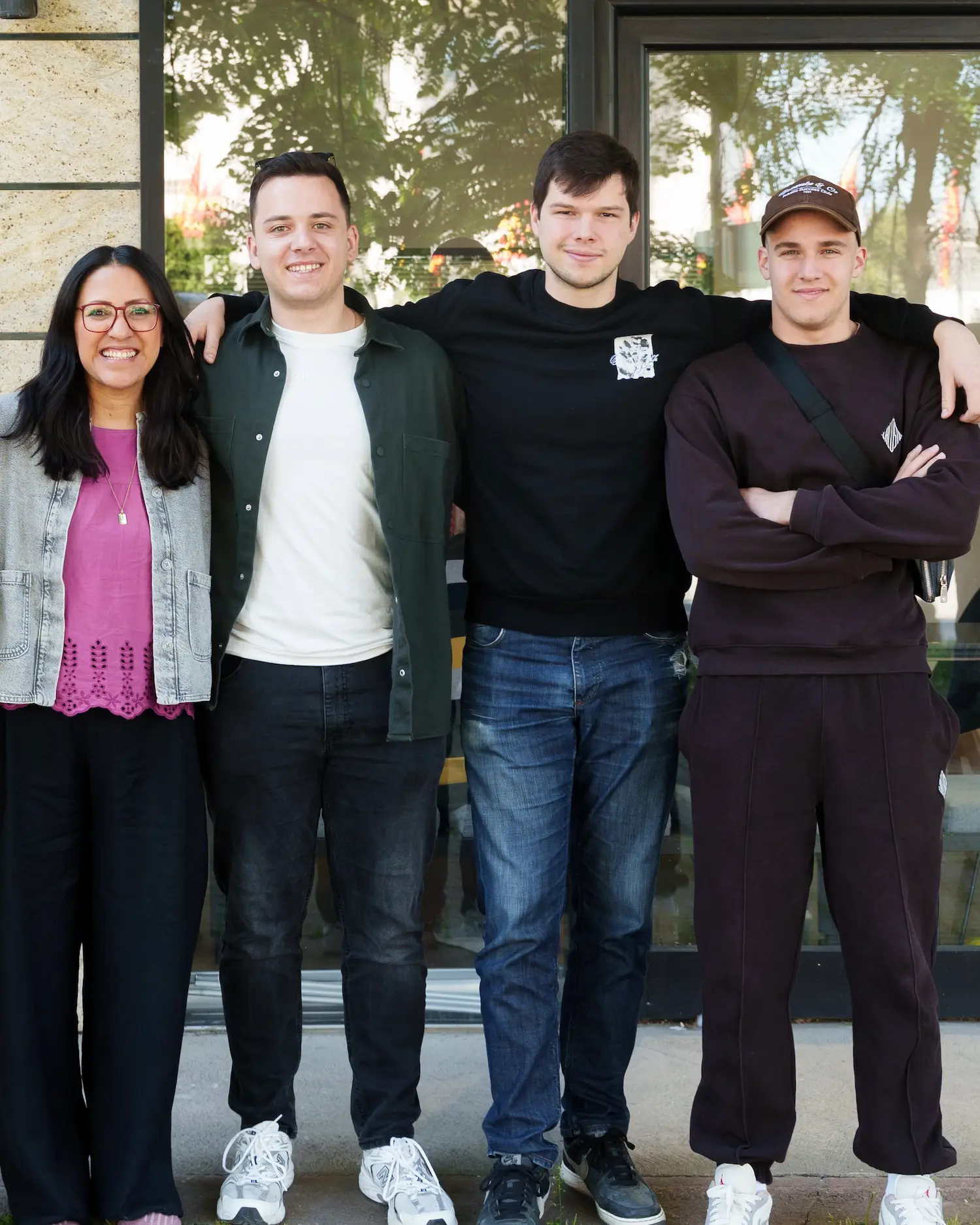 Four young adults from Soulcraft standing together outside